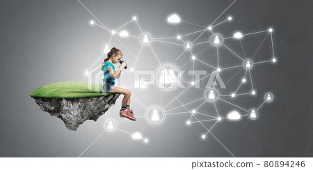 Concept of careless happy childhood with girl looking in binoculars 80894246