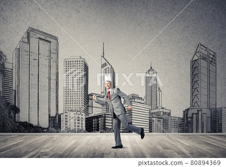 King businessman in elegant suit running and drawn cityscape silhouette at background 80894369