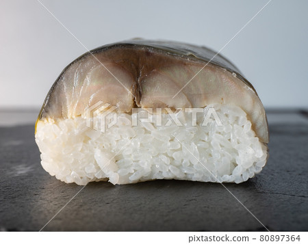 Cross section of mackerel stick sushi. A preserved food made by layering mackerel with vinegar and salt on top of vinegar rice. 80897364