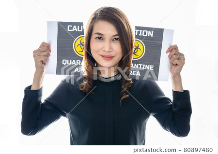 Woman shows her happy face between pieces of torn paper with Covid-19 quarantine area words. The idea or concept for the ending, happiness and free after finishing and recovered from Coronarivus Woman shows her happy face between pieces of torn paper with Covid-19 quarantine area words. The idea or concept for the ending, happiness and free after finishing and recovered from Coronarivus 80897480