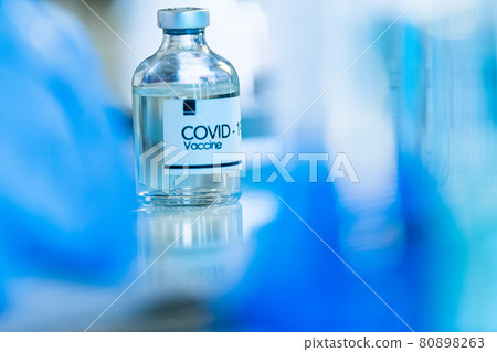 Bottle of COVOD-19 vaccine sample in a laboratory. Idea for researching and lab tests for coronavirus curing 80898263