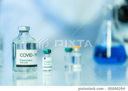 Bottle of COVOD-19 vaccine sample in a laboratory. Idea for researching and lab tests for coronavirus curing 80898264