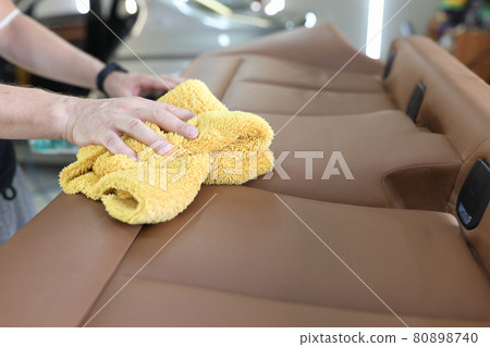 Car interior and leather seat cleaning closeup 80898740