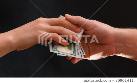 Addict buys a dose of drugs, white powder in a sachet on a black background. Addict buys a dose of drugs, white powder in a sachet on a black background. 80901411