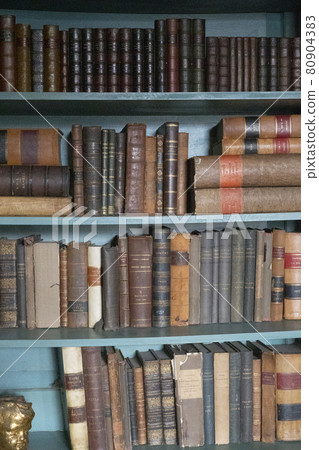 Hartlepool, U.K - July 27, 2021: The National Museum of The Royal Navy , in the North of England. Vintage library with old books on the shelves Hartlepool, U.K - July 27, 2021: The National Museum of The Royal Navy , in the North of England. Vintage library with old books on the shelves 80904383