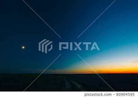 Orange, Yellow Blue Sunrise Sky With Sunlight Sunset Background Orange, Yellow Blue Sunrise Sky With Sunlight Sunset Background 80904595