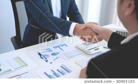 Business concept two entrepreneurs accepting the condition of the business contract after discussing about the startup model. Business concept two entrepreneurs accepting the condition of the business contract after discussing about the startup model. 80905183