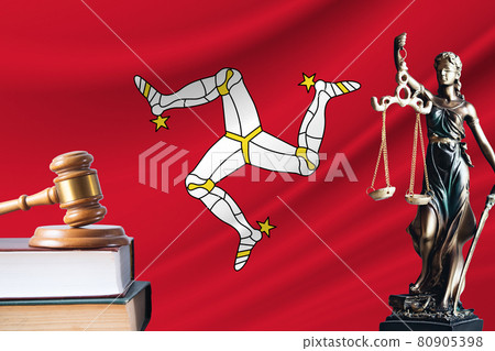 Law and justice in Isle of Man. Statue of themis and the gavel of the judge against the background of the flag of Isle of Man. Law and justice concept Law and justice in Isle of Man. Statue of themis and the gavel of the judge against the background of the flag of Isle of Man. Law and justice concept 80905398