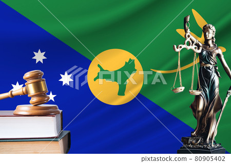 Law and justice in Christmas Island. Statue of themis and the gavel of the judge against the background of the flag of Christmas Island. Law and justice concept 80905402