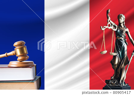 Law and justice in France. Statue of themis and the gavel of the judge against the background of the flag of France. Law and justice concept 80905417