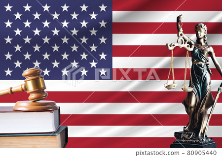 Law and justice in United States. Statue of themis and the gavel of the judge against the background of the flag of United States. Law and justice concept Law and justice in United States. Statue of themis and the gavel of the judge against the background of the flag of United States. Law and justice concept 80905440