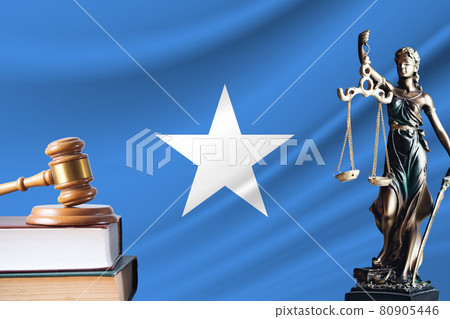 Law and justice in Somalia. Statue of themis and the gavel of the judge against the background of the flag of Somalia. Law and justice concept Law and justice in Somalia. Statue of themis and the gavel of the judge against the background of the flag of Somalia. Law and justice concept 80905446