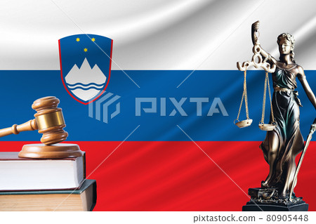 Law and justice in Slovenia. Statue of themis and the gavel of the judge against the background of the flag of Slovenia. Law and justice concept 80905448