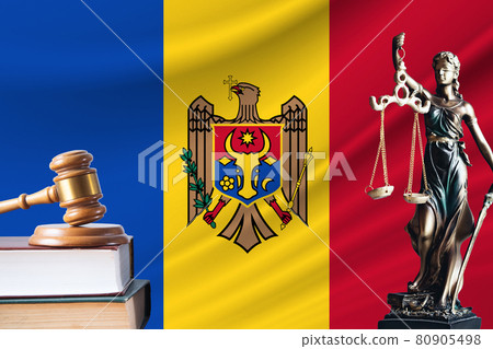 Law and justice in Moldova. Statue of themis and the gavel of the judge against the background of the flag of Moldova. Law and justice concept Law and justice in Moldova. Statue of themis and the gavel of the judge against the background of the flag of Moldova. Law and justice concept 80905498