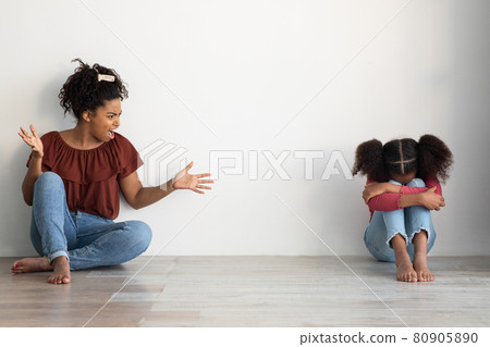 Mad black lady shouting at her crying female kid Mad black lady shouting at her crying female kid 80905890