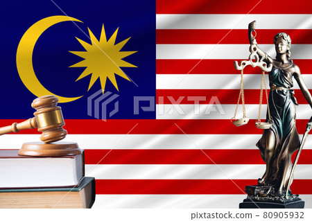 Law and justice in Malaysia. Statue of themis and the gavel of the judge against the background of the flag of Malaysia. Law and justice concept Law and justice in Malaysia. Statue of themis and the gavel of the judge against the background of the flag of Malaysia. Law and justice concept 80905932