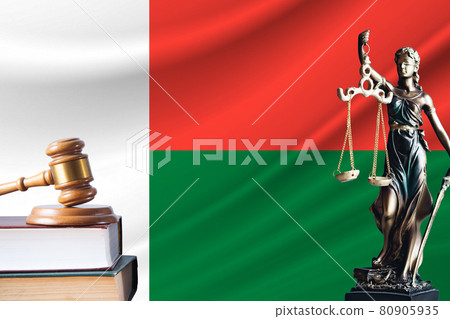 Law and justice in Madagascar. Statue of themis and the gavel of the judge against the background of the flag of Madagascar. Law and justice concept Law and justice in Madagascar. Statue of themis and the gavel of the judge against the background of the flag of Madagascar. Law and justice concept 80905935