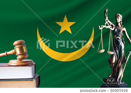 Law and justice in Mauritania. Statue of themis and the gavel of the judge against the background of the flag of Mauritania. Law and justice concept Law and justice in Mauritania. Statue of themis and the gavel of the judge against the background of the flag of Mauritania. Law and justice concept 80905936