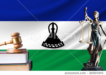 Law and justice in Lesotho Statue of themis and the gavel of the judge against the background of the flag of Lesotho Law and justice concept 80905945