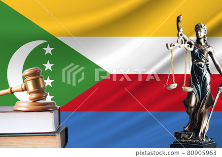 Law and justice in Comoros Statue of themis and the gavel of the judge against the background of the flag of Comoros Law and justice concept Law and justice in Comoros Statue of themis and the gavel of the judge against the background of the flag of Comoros Law and justice concept 80905963