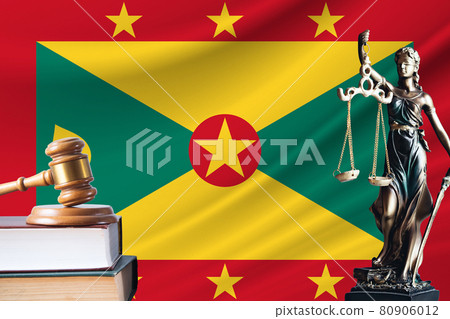 Law and justice in Grenada. Statue of themis and the gavel of the judge against the background of the flag of Grenada. Law and justice concept Law and justice in Grenada. Statue of themis and the gavel of the judge against the background of the flag of Grenada. Law and justice concept 80906012