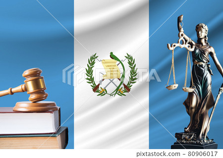 Law and justice in Guatemala. Statue of themis and the gavel of the judge against the background of the flag of Guatemala. Law and justice concept Law and justice in Guatemala. Statue of themis and the gavel of the judge against the background of the flag of Guatemala. Law and justice concept 80906017