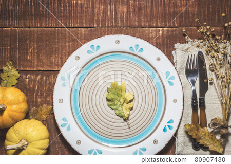 Thanksgiving or autumn table setting 80907480
