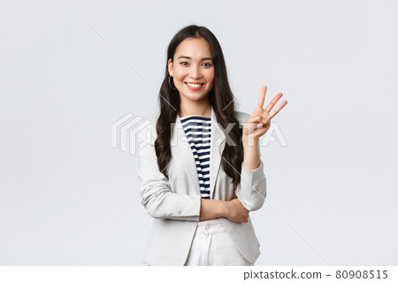 Business, finance and employment, female successful entrepreneurs concept. Successful female businesswoman, asian real estate broker pointing finger, showing number three and smiling Business, finance and employment, female successful entrepreneurs concept. Successful female businesswoman, asian real estate broker pointing finger, showing number three and smiling 80908515