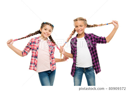 Doing cute and easy hair style. Happy children hold long Doing cute and easy hair style. Happy children hold long 80909372