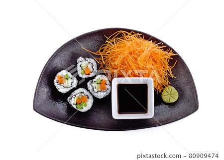 Sushi roll with vegetable on plate on white background Sushi roll with vegetable on plate on white background 80909474