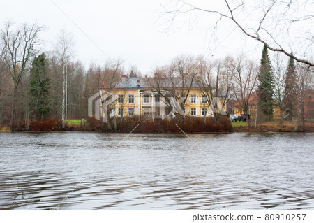 KOUVOLA, FINLAND - NOVEMBER 5, 2018: Beautiful wooden Rabbelugn Manor - Takamaan Kartano in autumn day. Wrede family house was built in 1820 on the river Kymijoki bank KOUVOLA, FINLAND - NOVEMBER 5, 2018: Beautiful wooden Rabbelugn Manor - Takamaan Kartano in autumn day. Wrede family house was built in 1820 on the river Kymijoki bank 80910257