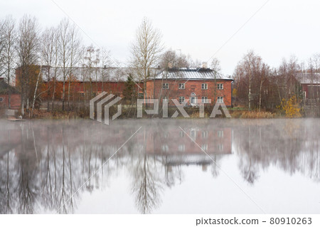 KOUVOLA, FINLAND - OCTOBER 23, 2018: Beautiful wooden Rabbelugn Manor - Takamaan Kartano in fog autumn day. Wrede family house was built in 1820 on the river Kymijoki bank 80910263