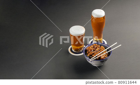 Katsudon chicken rice with beer on gray background Katsudon chicken rice with beer on gray background 80911644