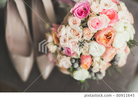 Beautiful wedding bouquet with different flowers, roses Beautiful wedding bouquet with different flowers, roses 80911645