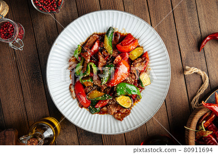 Chinese warm beef salad with vegetables Chinese warm beef salad with vegetables 80911694