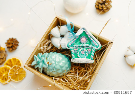 Christmas gift with gingerbread house made of polymer clay. Christmas gift with gingerbread house made of polymer clay. 80911697
