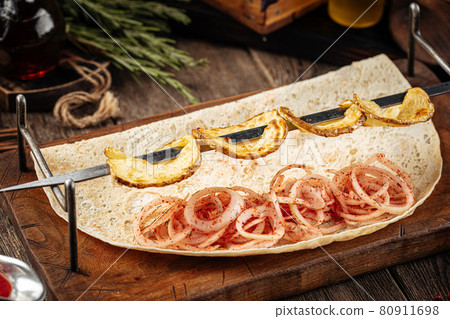 Caucasian grilled potato shashlyq skewers 80911698
