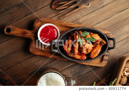 Plate of fried wings in teriyaki sauce Plate of fried wings in teriyaki sauce 80911774