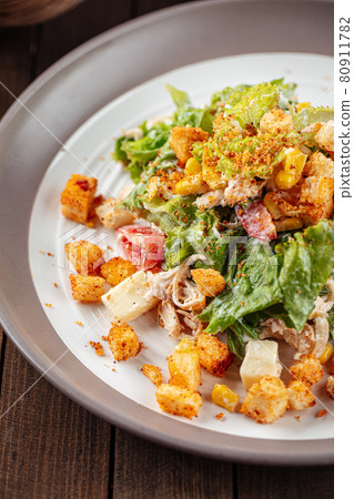 Russian malibu salad with croutons and ham Russian malibu salad with croutons and ham 80911782