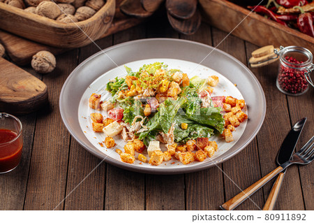 Russian malibu salad with croutons and ham 80911892