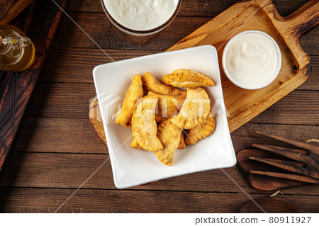 Plate of fried cheburek meat stuffed pies Plate of fried cheburek meat stuffed pies 80911927