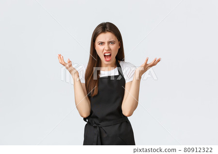 Grocery store employees, small business and coffee shops concept. Angry displeased female barista shouting and complaining at someone, raise hands in dismay grimacing bothered Grocery store employees, small business and coffee shops concept. Angry displeased female barista shouting and complaining at someone, raise hands in dismay grimacing bothered 80912322