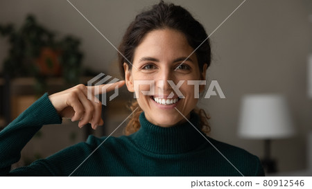 Head shot portrait smiling woman pointing on eyes, laser surgery Head shot portrait smiling woman pointing on eyes, laser surgery 80912546