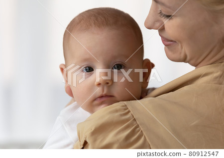 Close up newborn baby in mother arms Close up newborn baby in mother arms 80912547
