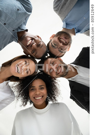 Low angle portrait of smiling diverse employees together 80912649