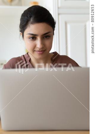 Narrow view of Indian woman use laptop Narrow view of Indian woman use laptop 80912653