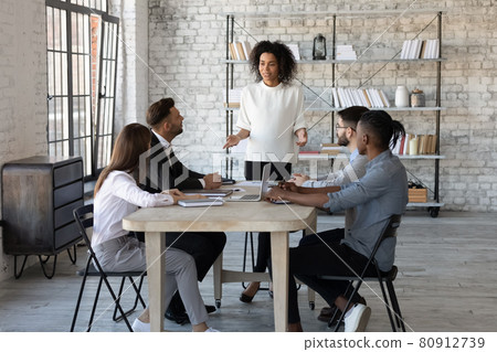 Successful African American female boss lead meeting with colleagues Successful African American female boss lead meeting with colleagues 80912739