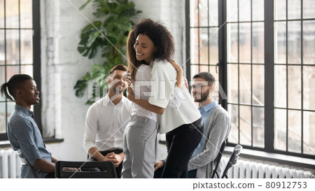Smiling diverse people hug recovering at counseling session 80912753