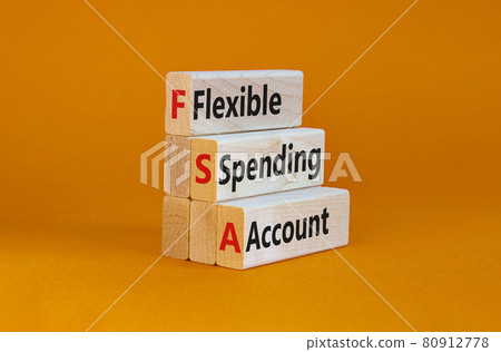 FSA flexible spending account symbol. Concept words FSA flexible spending account on wooden blocks on a beautiful orange background. Business and FSA flexible spending account concept. 80912778
