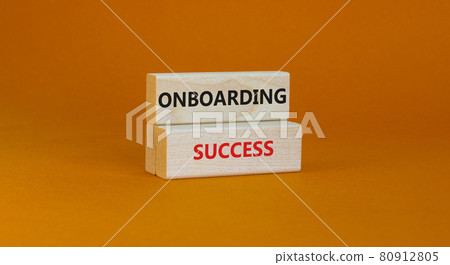 Onboarding success symbol. Wooden blocks with words Onboarding success on beautiful orange background. Business and onboarding success concept. Copy space. Onboarding success symbol. Wooden blocks with words Onboarding success on beautiful orange background. Business and onboarding success concept. Copy space. 80912805